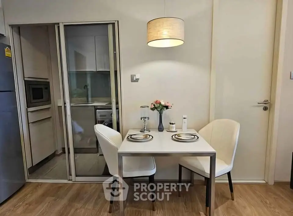 Cozy dining area with modern kitchen and elegant decor