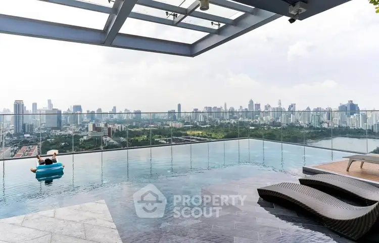 Stunning rooftop pool with panoramic city skyline view, perfect for luxury urban living.