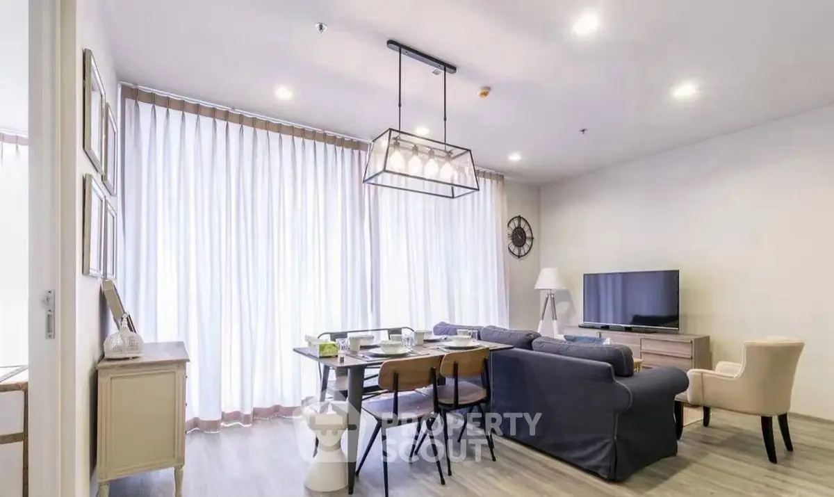 Stylish modern living room with elegant decor and ample natural light