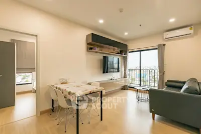 Modern living room with balcony view and stylish furniture