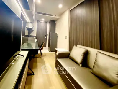 Modern living room with sleek design and cozy seating in a stylish apartment.