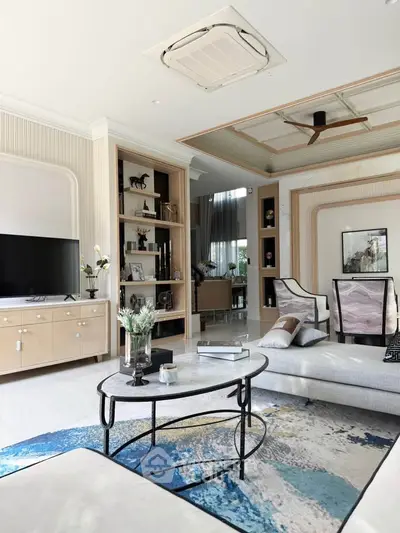 Luxurious living room with modern decor, stylish furniture, and elegant design elements.