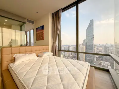 Luxurious bedroom with stunning city view in high-rise apartment