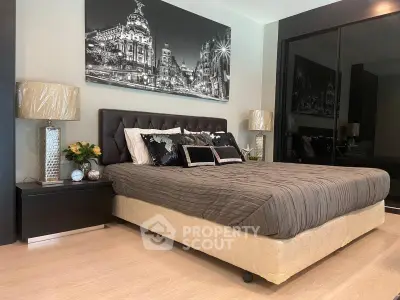 Luxurious bedroom with elegant decor and mirrored wardrobe doors