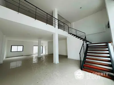 Spacious modern duplex with sleek staircase and open layout