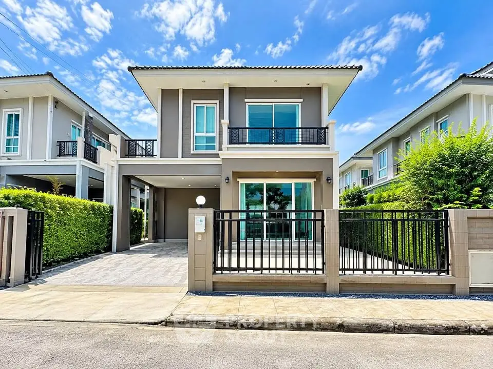 Modern two-story house with sleek design and spacious driveway in a serene neighborhood.