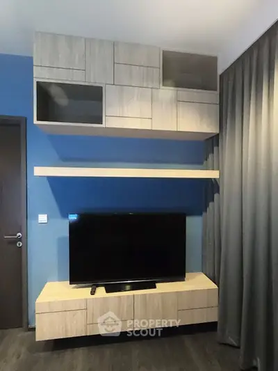 Modern living room with sleek TV unit and stylish cabinetry