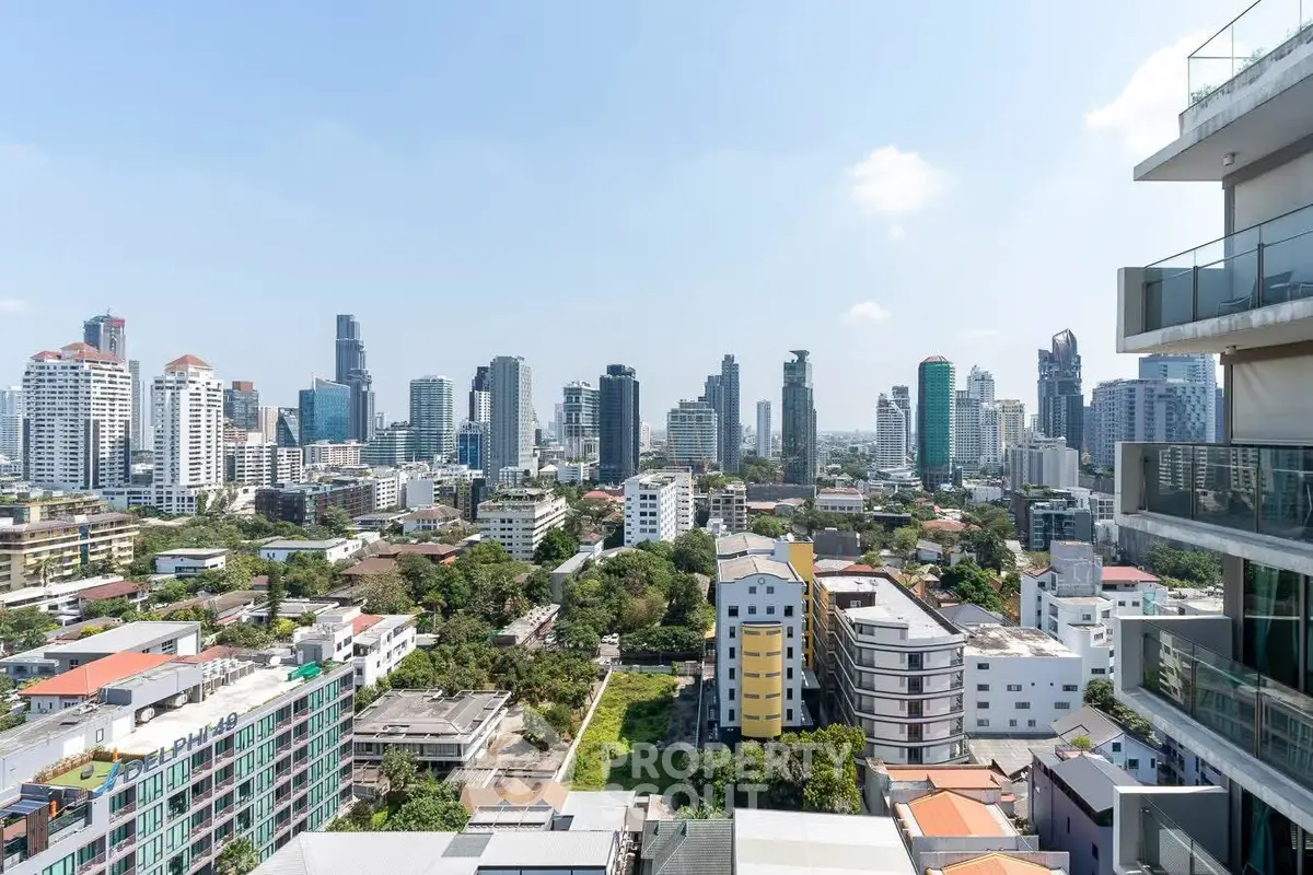 Stunning cityscape view from a high-rise balcony showcasing modern urban skyline.