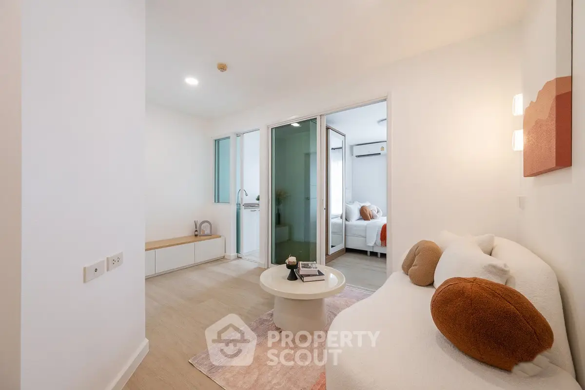 Modern living room with cozy sofa and stylish decor in bright apartment