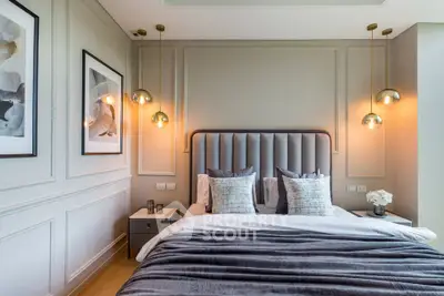 Luxurious modern bedroom with elegant lighting and plush bedding