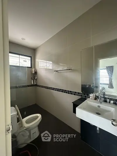 Modern bathroom with sleek design and large mirror