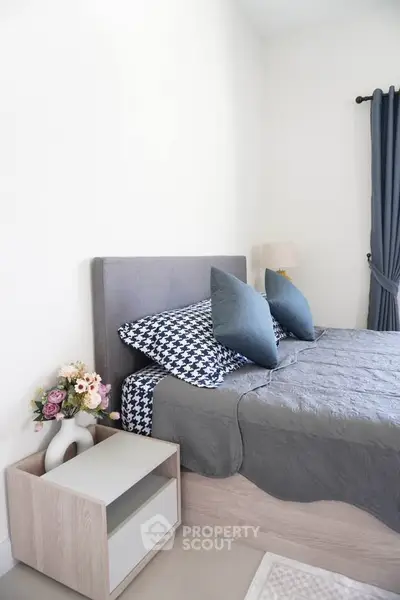 Cozy bedroom with modern decor and stylish bedding