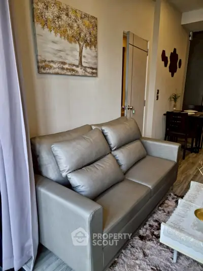 Modern living room with stylish gray sofa and elegant decor