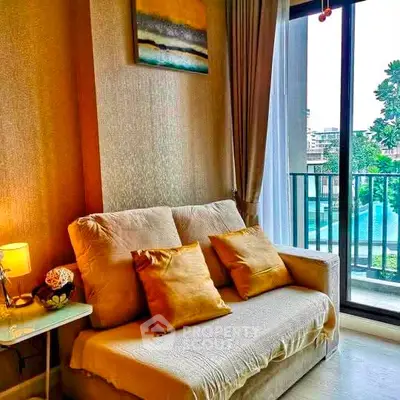 Cozy living room with plush sofa and balcony view in modern apartment