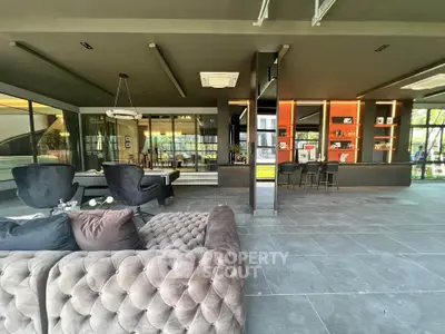 Luxurious modern living room with plush seating and stylish decor in a contemporary open layout.