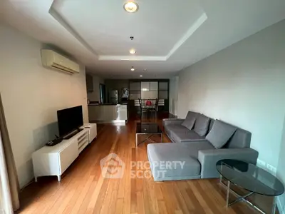 Spacious modern living room with sleek furniture and wooden flooring