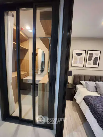 Modern bedroom with sliding glass door and stylish decor