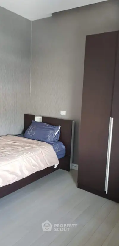 Cozy bedroom with modern design and sleek wardrobe