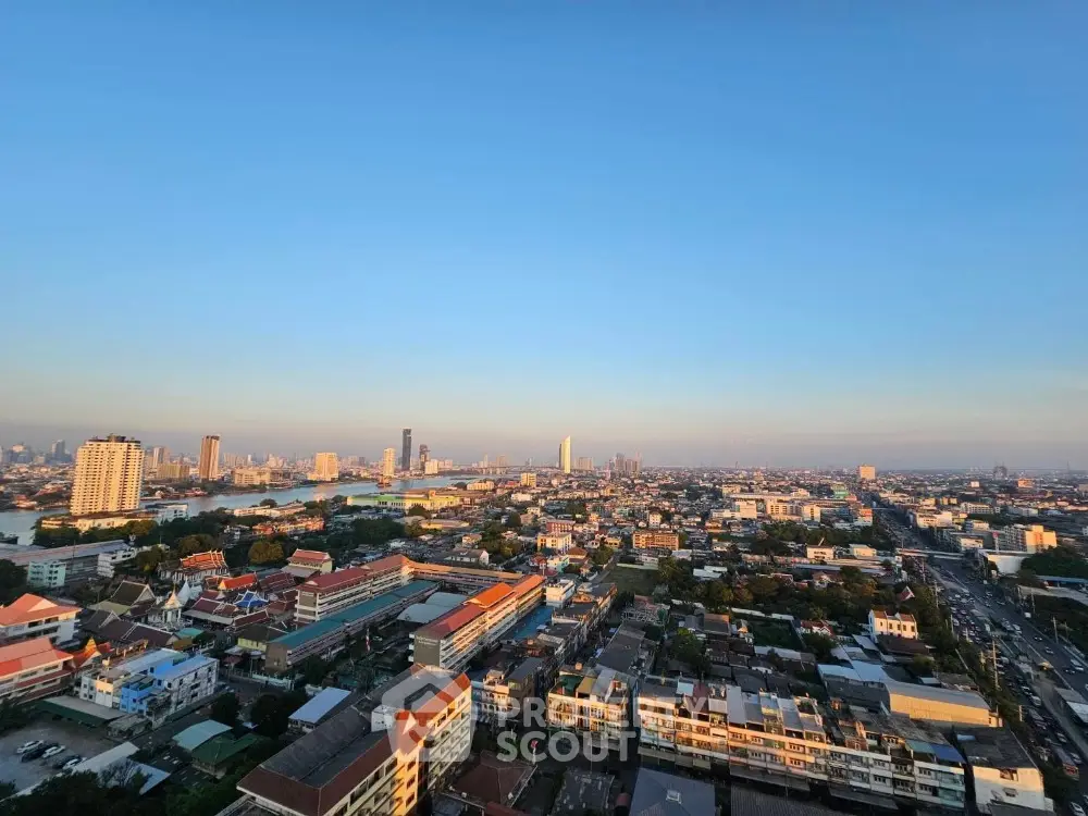 Breathtaking panoramic cityscape at dusk, showcasing a vibrant urban horizon with a blend of modern high-rises and traditional buildings.