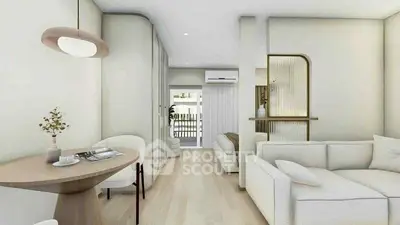 Modern living room with elegant decor and open layout, featuring cozy seating and stylish lighting.