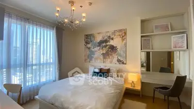 Elegant bedroom with modern decor and large window view