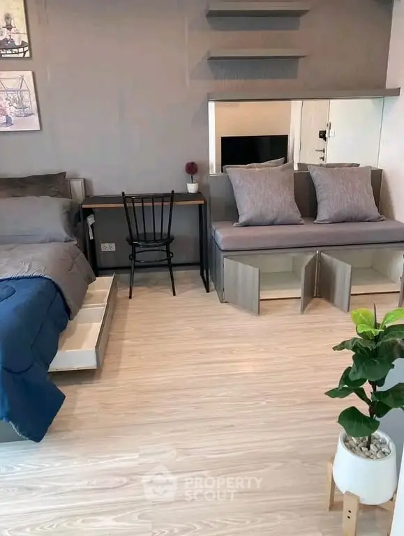 Modern bedroom with stylish decor and functional furniture in a cozy apartment.