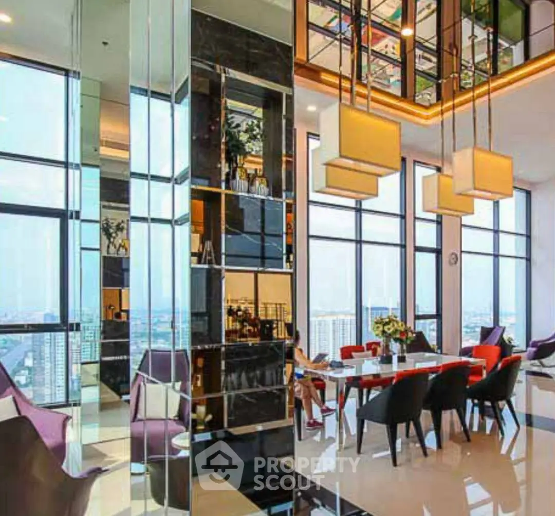 Luxurious modern living room with panoramic city views and elegant decor.