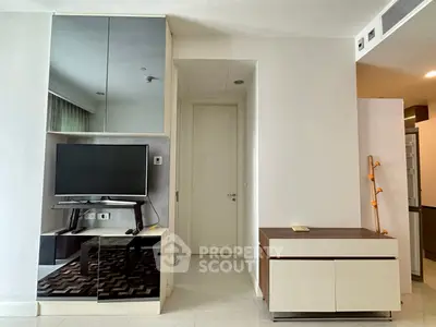 Modern living room with sleek TV unit and stylish decor, perfect for contemporary living.