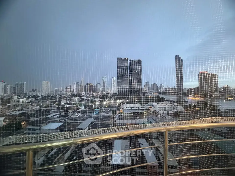 Stunning cityscape view from a high-rise balcony with modern skyline.