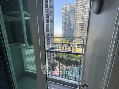 Modern apartment balcony with city view and sports court below