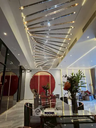 Luxurious modern living room with unique ceiling design and elegant decor