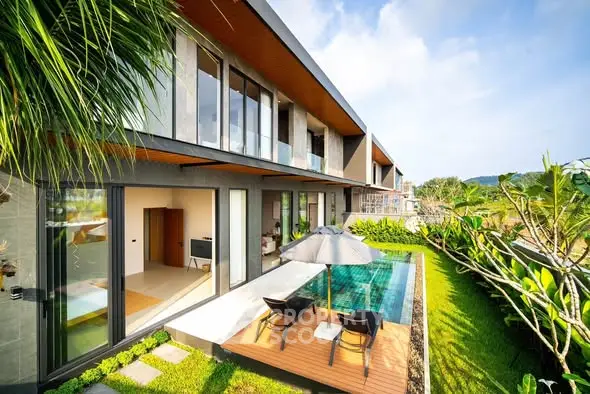 Luxurious modern villa with private pool and lush garden, perfect for serene living.