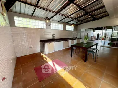 Spacious open-layout kitchen with modern design and ample natural light