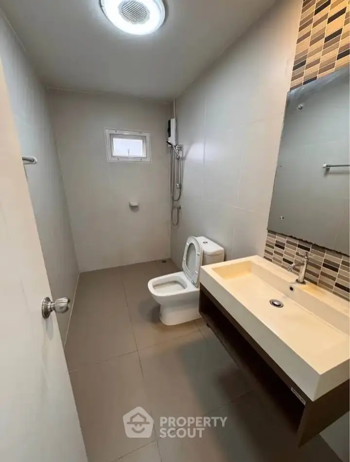 Modern bathroom with sleek fixtures and stylish tile accents