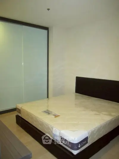 Spacious bedroom with modern design and large bed in a cozy apartment.