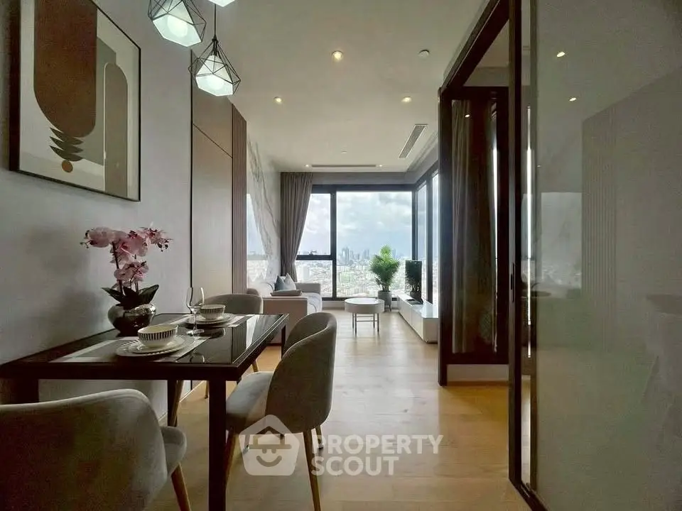 Modern living room with panoramic city view and elegant dining area