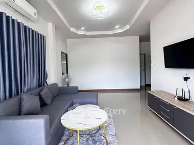 Modern living room with sleek furniture and stylish decor in a contemporary apartment.