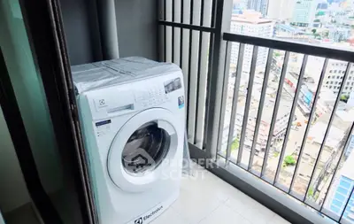 High-rise balcony with washing machine and city view