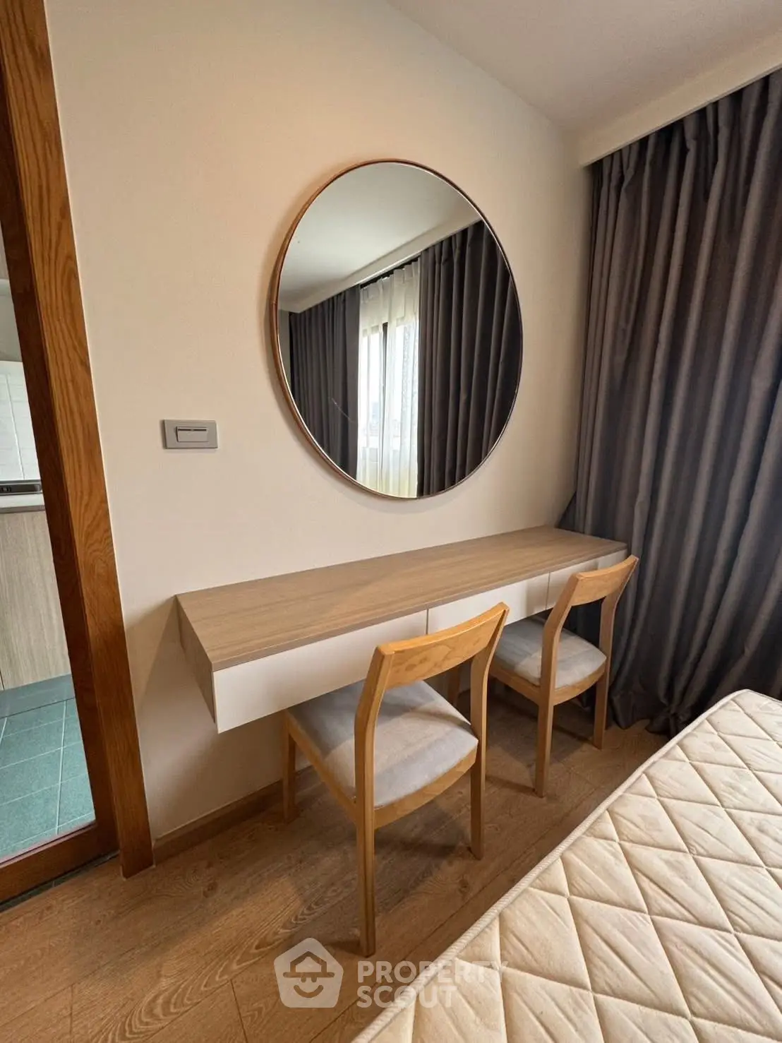 Modern bedroom with stylish mirror and elegant furniture