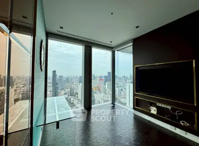Stunning high-rise corner unit with panoramic city views and modern interior design.