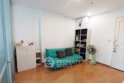 Cozy living room with teal sofa and modern storage solutions