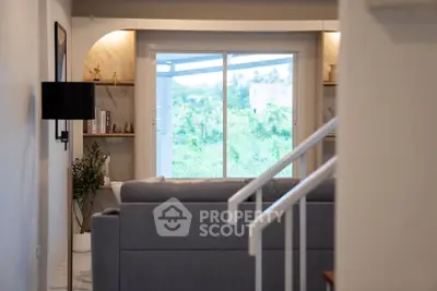 Modern living room with large window and stylish decor