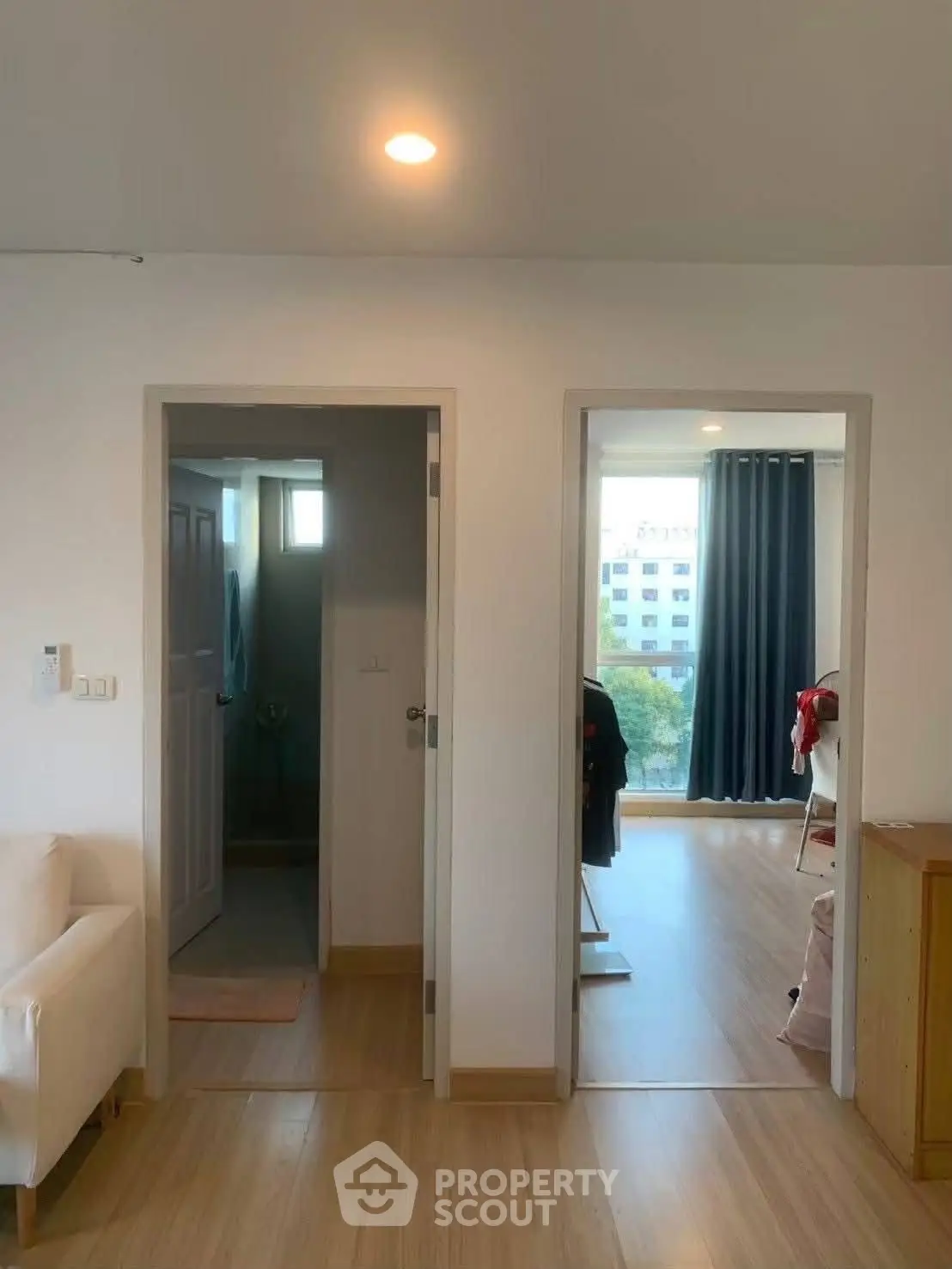 Modern apartment interior with bright living space and wooden flooring