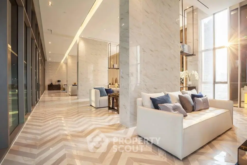 Luxurious modern living room with elegant marble flooring and plush seating in a high-rise building.