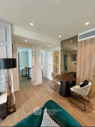 Modern living room with stylish furniture and wooden flooring in a contemporary apartment.