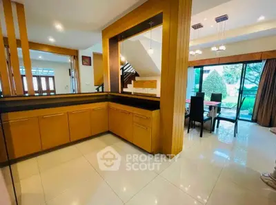 Spacious open-plan living area with modern dining space and garden view