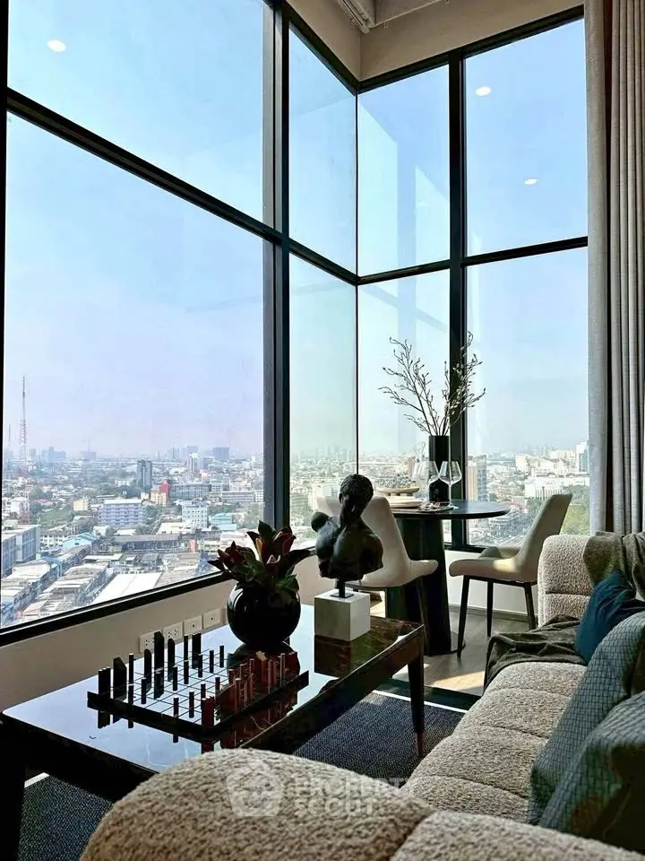 Luxurious corner unit living room with panoramic city views and elegant decor.