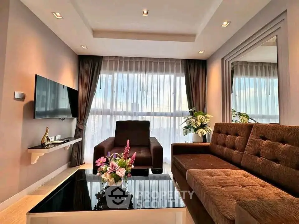 Luxurious living room with modern decor and large windows