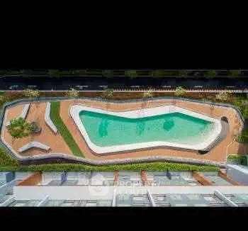 Stunning aerial view of modern swimming pool in luxury residential complex.
