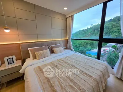 Luxurious bedroom with panoramic window view of lush greenery, featuring modern decor and cozy ambiance.